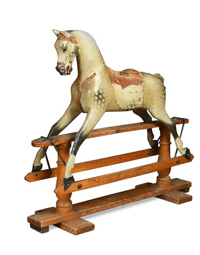 Lot 697 - A Victorian dapple grey painted wood rocking horse