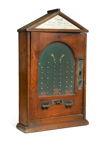 Lot 162 - A Tivoli 'Test Your Skill' wall mounted coin drop cigar machine