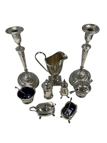 Lot 335 - Two silver three-piece cruet sets, together...