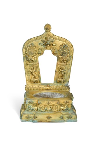 Lot 63 - A Tibetan gilt bronze Kirtimukha throne (Singhasan)