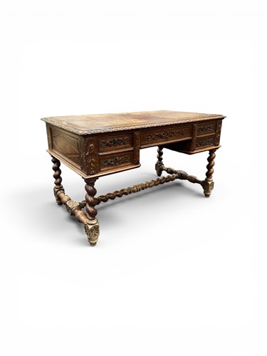 Lot 404 - A Victorian carved oak writing desk, fitted...