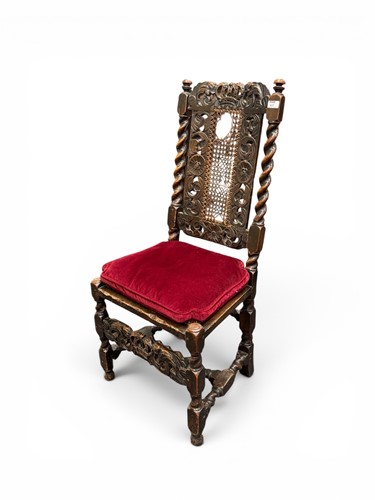 Lot 417 - A Charles II carved walnut caned back side...