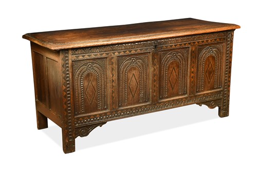 Lot 371 - A carved and inlaid oak four panel coffer, 17th century
