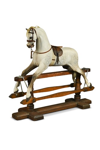 Lot 690 - An Edwardian and restored painted wood rocking horse