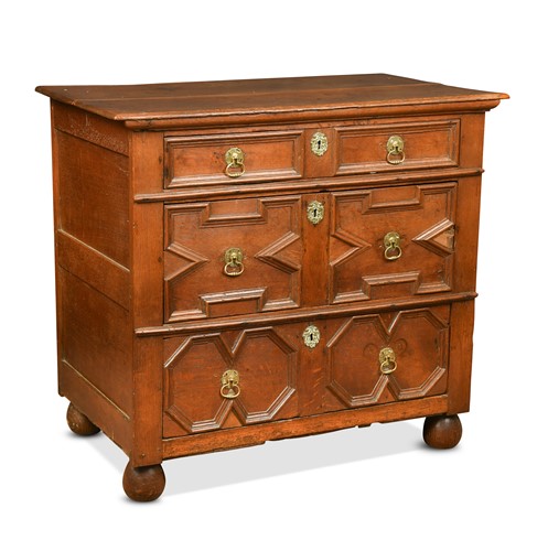 Lot 383 - An oak geometric moulded chest of drawers, late 17th century