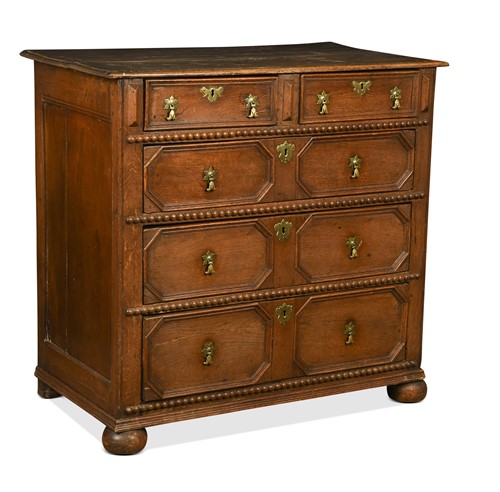 Lot 375 - An oak geometric moulded chest of drawers, late 17th century