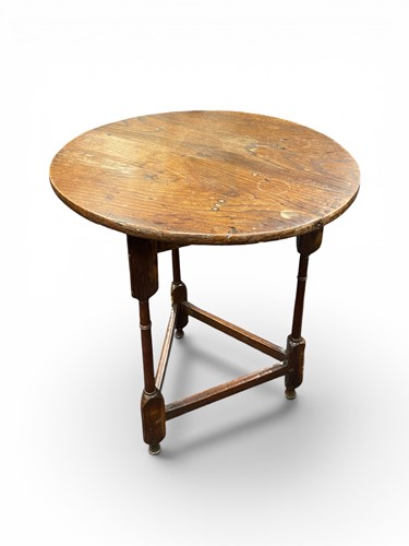 Lot 377 - An oak circular top cricket table, late 19th...