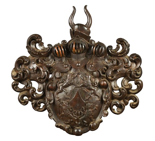Lot 365 - A carved and stained wood armorial shield crest, probably 18th century