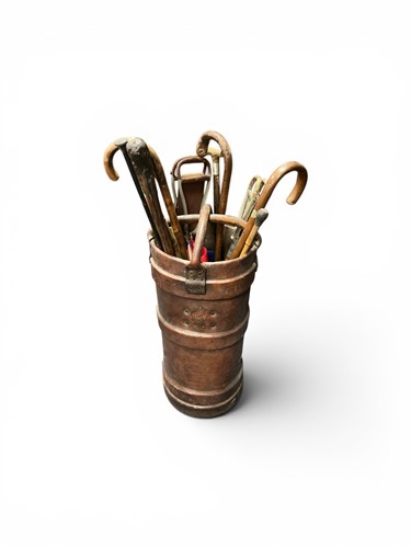 Lot 132 - A leather munitions case as an umbrella stand,...