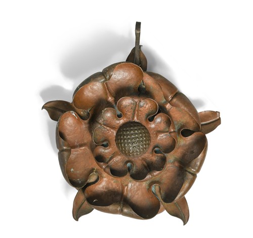 Lot 389 - An Arts & Crafts copper flower head boss