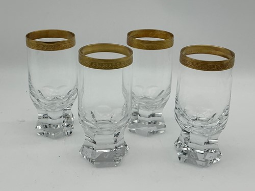 Lot 6 - A set of four Moser drinking glasses with gilt...