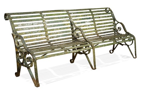 Lot 713 - A green painted wrought iron four seat garden bench, late 19th century