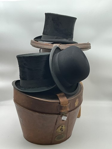Lot 119 - Two black silk top hats, 20th century, both in...