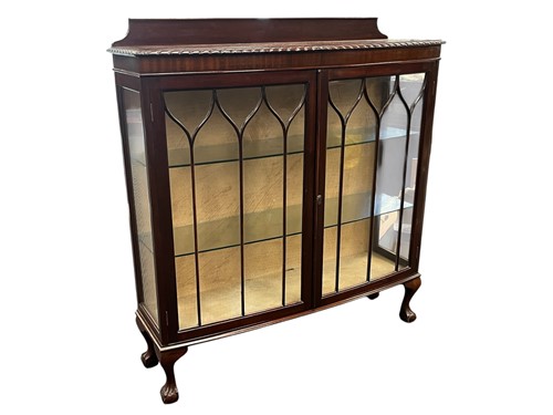 Lot 649 - A mahogany bow-fronted cabinet, 20th century