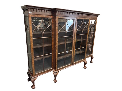 Lot 636 - A large mahogany breakfront bookcase, 20th century