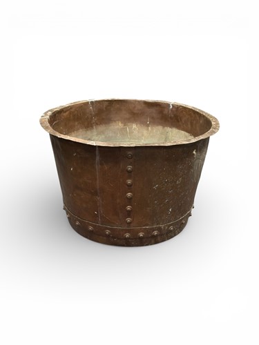 Lot 583 - A riveted copper log bin 36.5 x 56cm