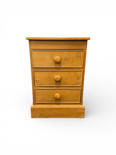Lot 623 - A modern pine beside chest of drawers...