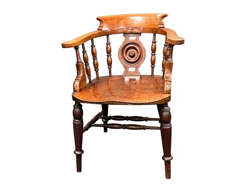 Lot 648 - A smokers bow armchair, 20th century, with an...