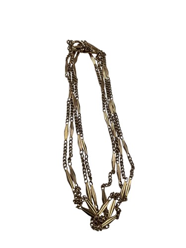 Lot 280 - A long guard chain, stamped '12K', weight 20.9g