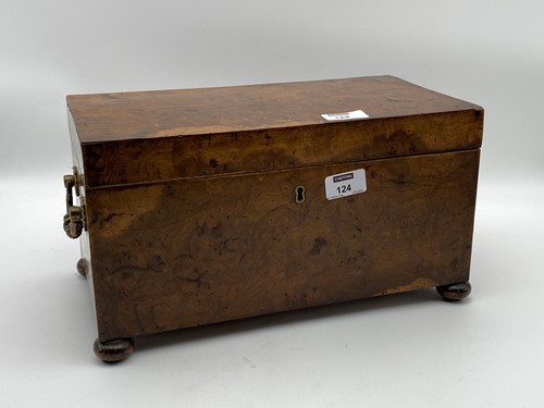 Lot 124 - A Georgian walnut tea caddy with bun feet