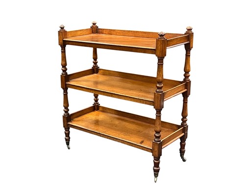 Lot 577 - A mahogany three-tier buffet, 19th century