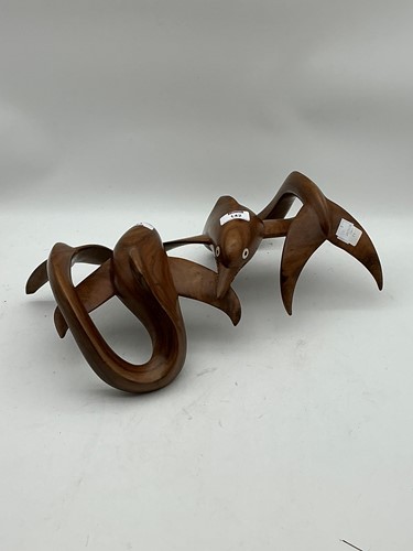 Lot 142 - A teak sculpture in the form of a pair of...