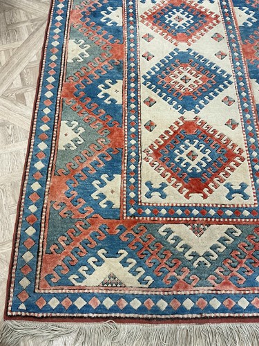 Lot 730 - A Herati style wool rug in warm reds and...