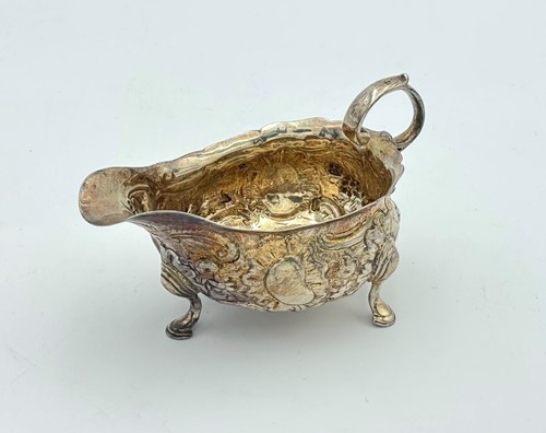 Lot 72 - A George II silver sauce boat