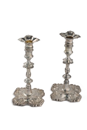 Lot 323 - A matched pair of George II cast silver candlesticks