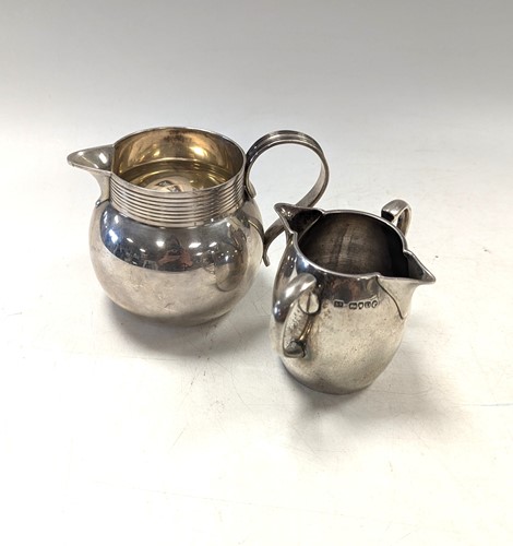 Lot 71 - Two silver cream jugs