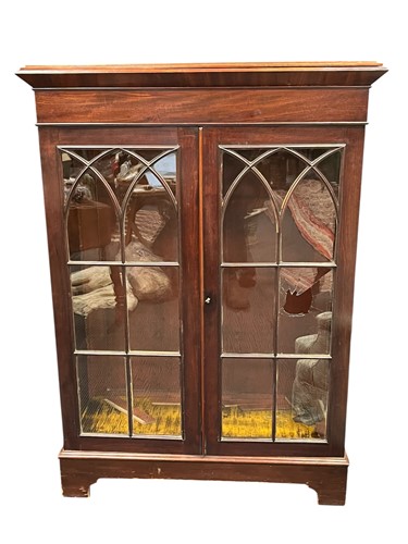 Lot 598 - A mahogany glazed bookcase, adapted