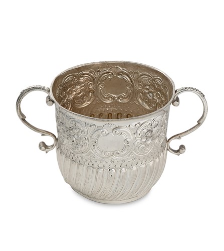 Lot 311 - A large William III Britannia silver porringer