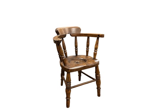 Lot 711 - An early 20th century elm seated child's stick...