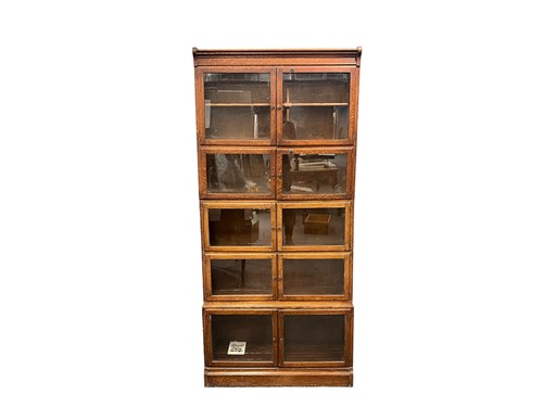 Lot 713 - An oak five section stacking glazed bookcase,...