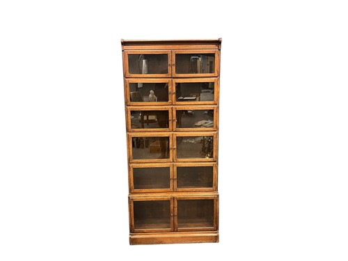 Lot 714 - An oak six section stacking glazed bookcase,...