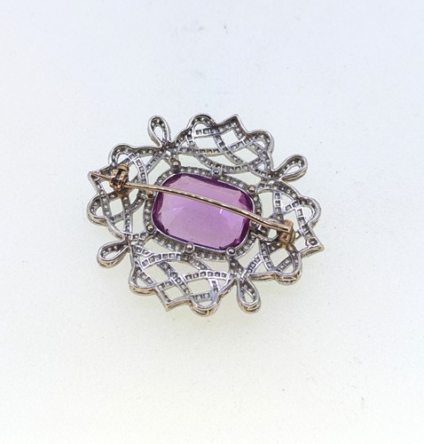 Lot 213 - An early 20th century pink topaz and diamond brooch