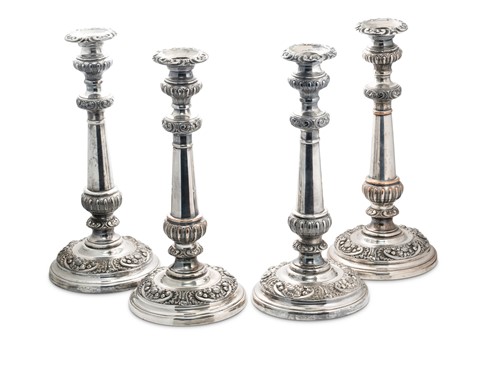 Lot 458 - A fine set of four silver plated table candlesticks