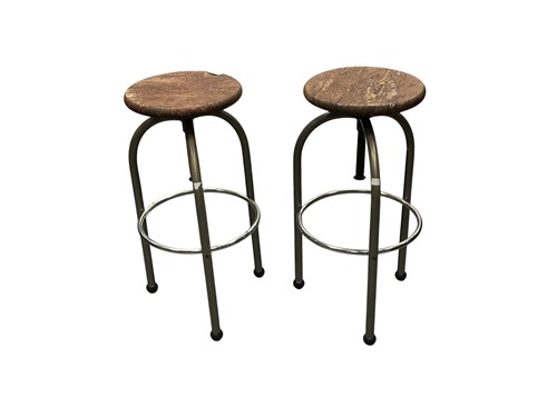 Lot 429 - A pair of industrial bar stools, late 20th...