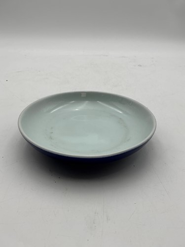 Lot 214 - An Imperial style white glazed saucer with...