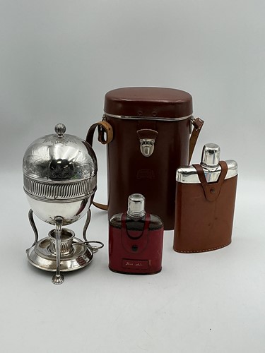 Lot 368 - Two leather clad hip flasks, together with a...
