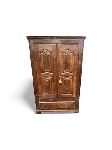 Lot 690 - A provincial French two-door oak wardrobe or...