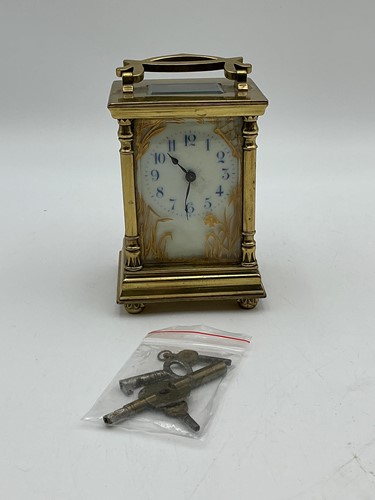 Lot 183 - A carriage clock with blue numbered dial and...