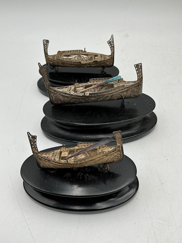 Lot 332 - Three white metal Maltese dhows on ebonised...