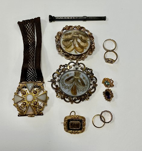 Lot 337 - Two large mourning brooches, tested as base...