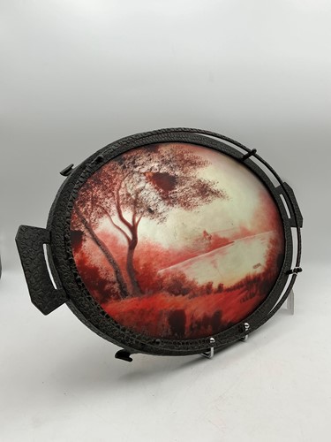 Lot 239 - An Art Deco reverse painted and wrought iron tray