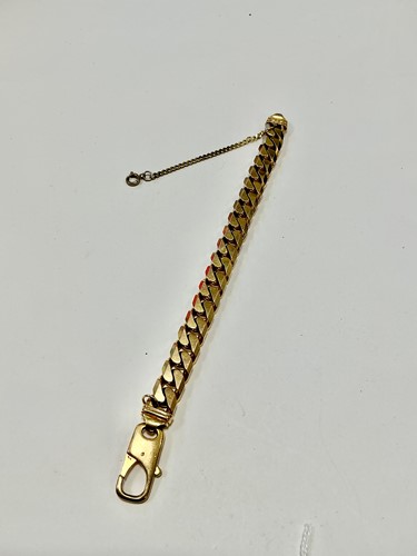 Lot 343 - A hallmarked 9ct gold curb bracelet, weight 90g