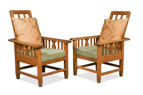 Lot 176 - A pair of Arts & Crafts pale oak reclining armchairs