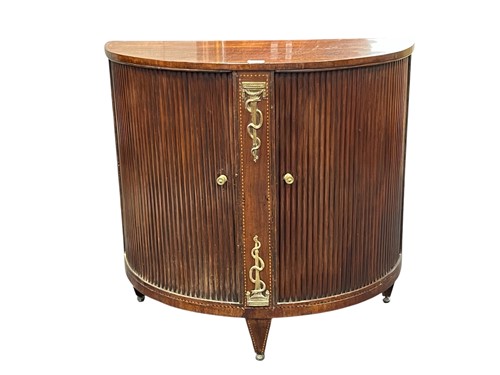 Lot 550 - A Regency mahogany demi lune cupboard, with...
