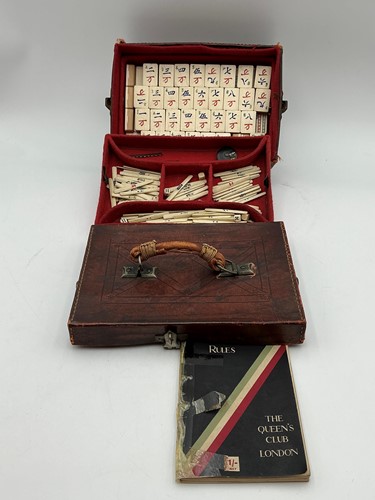 Lot 180 - A leather cased bone Mahjong set, with lift...