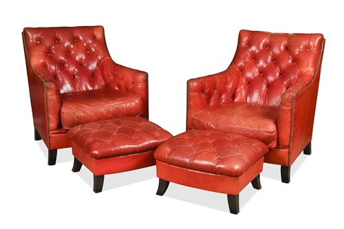 Lot 236 - A pair of Tetrad Debussy button back red leather armchairs and footstools